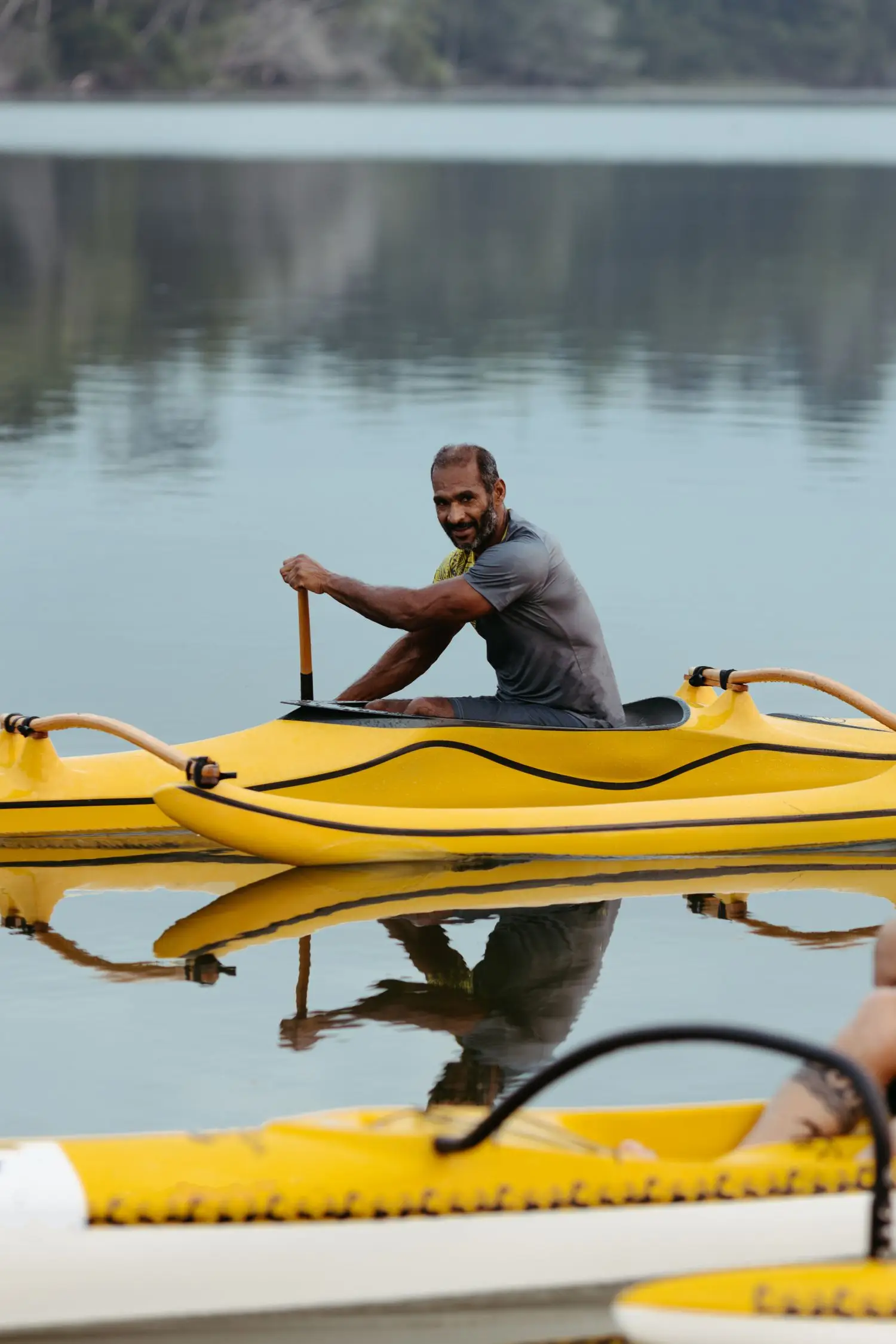 Paddler preparing a yellow kayak