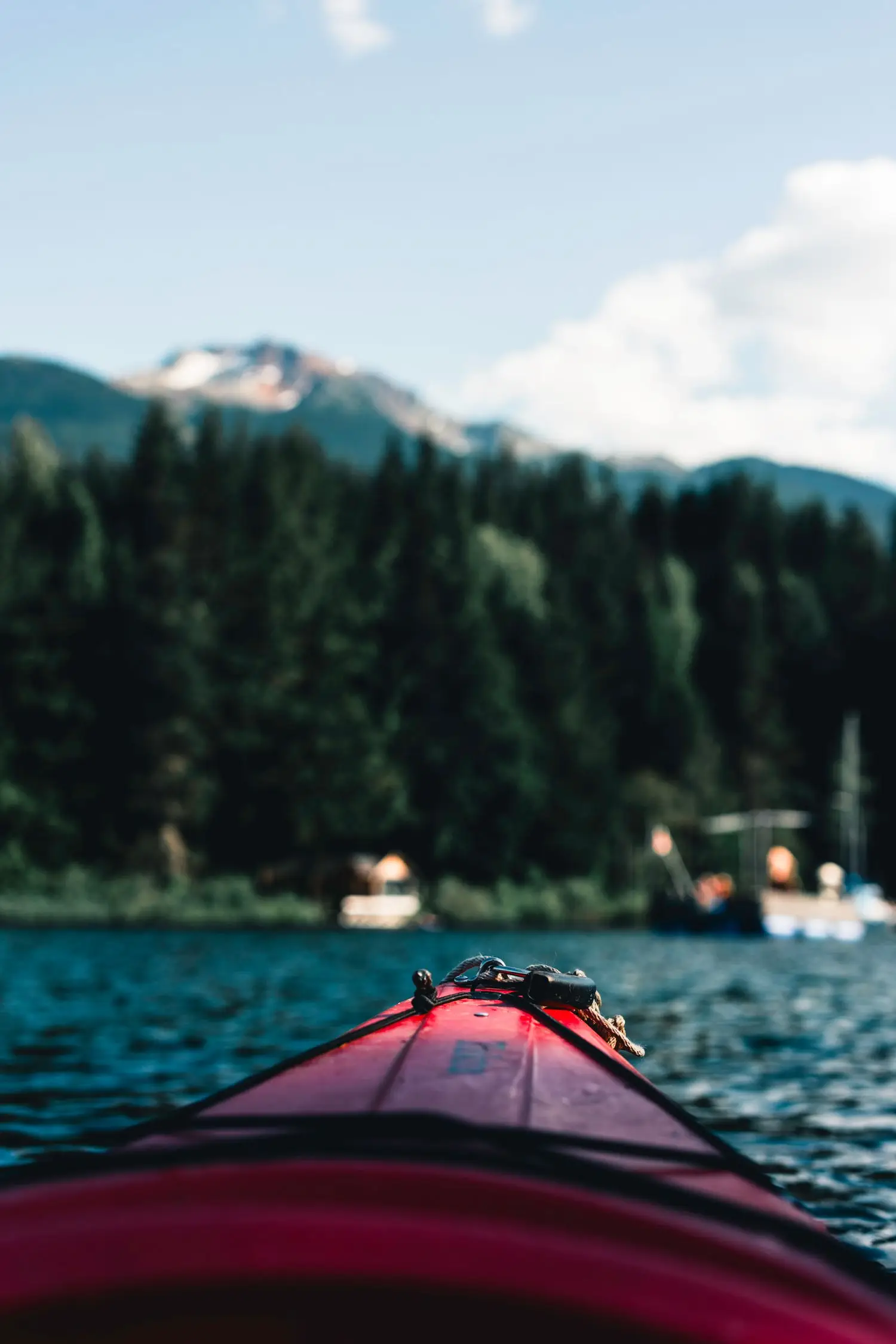 View from a red kayak on blue water